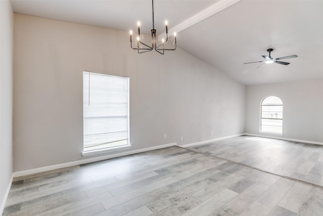 unfurnished room with lofted ceiling with beams, baseboards, wood finished floors, and ceiling fan with notable chandelier