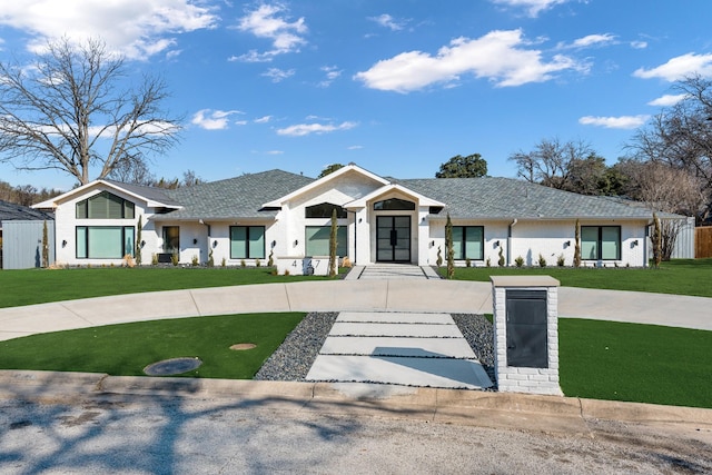 modern inspired farmhouse featuring a front lawn