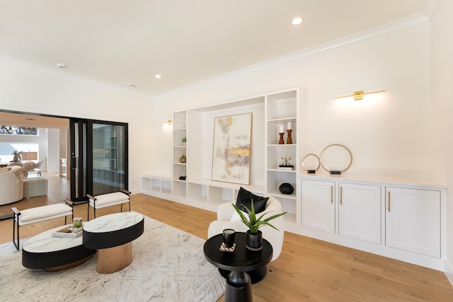 living area with ornamental molding, light wood finished floors, visible vents, and recessed lighting