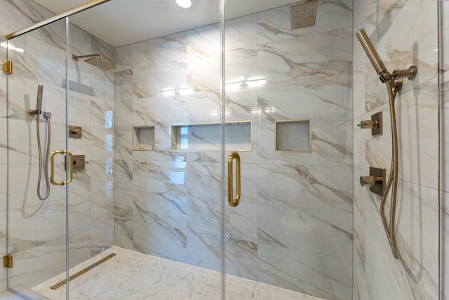 full bath with a marble finish shower