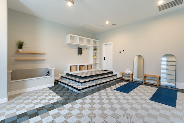 tiled bedroom featuring arched walkways, visible vents, baseboards, and recessed lighting