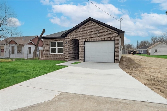 ranch-style house with a front yard, concrete driveway, brick siding, and an attached garage