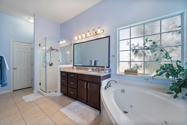 full bathroom featuring vanity, a tub with jets, a shower stall, and tile patterned flooring