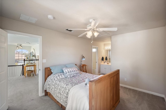 bedroom with a ceiling fan, carpet, visible vents, baseboards, and ensuite bathroom