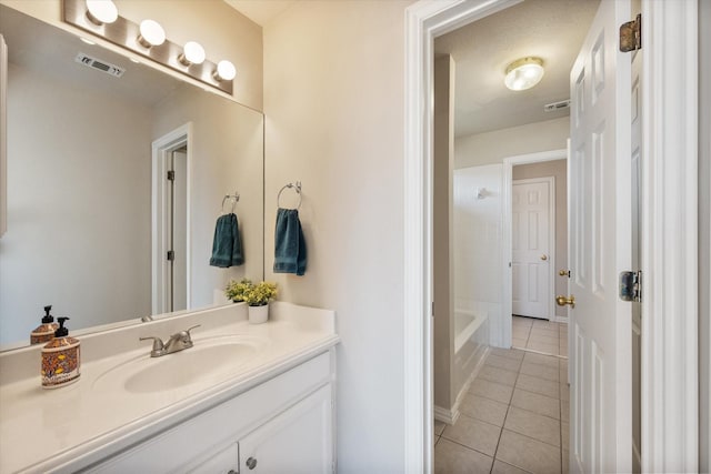 full bath with tile patterned flooring, visible vents, and vanity