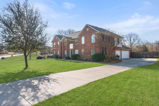 view of front facade featuring brick siding, fence, a front yard, a garage, and driveway