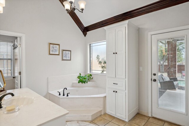 full bath with ornamental molding, vaulted ceiling, a bath, a chandelier, and tile patterned floors