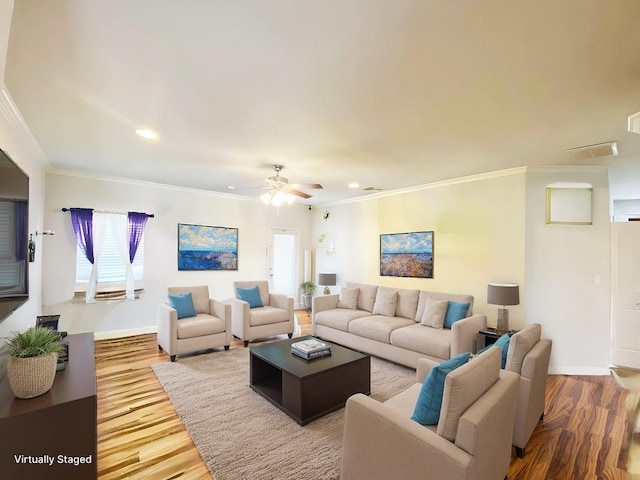 living area featuring ceiling fan, recessed lighting, wood finished floors, baseboards, and crown molding