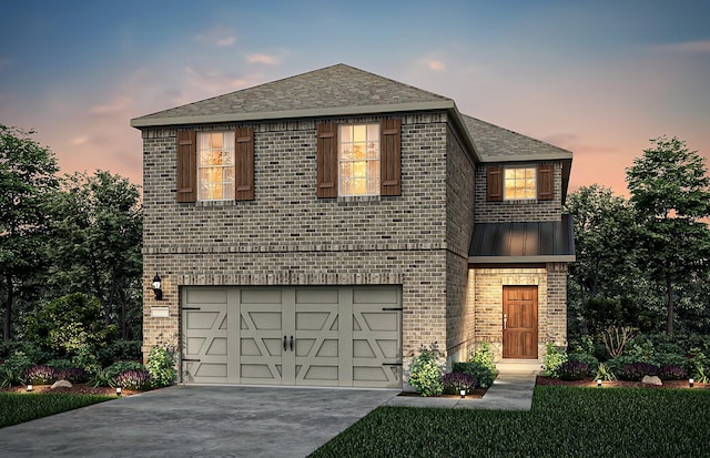 view of front of property featuring a garage, metal roof, brick siding, and concrete driveway