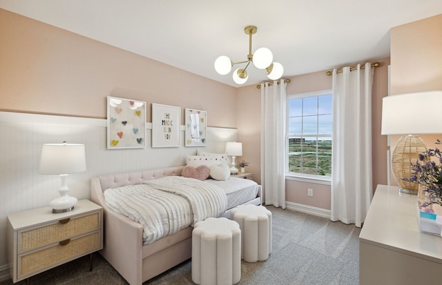 bedroom featuring carpet floors and a chandelier