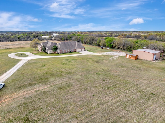 birds eye view of property with a rural view