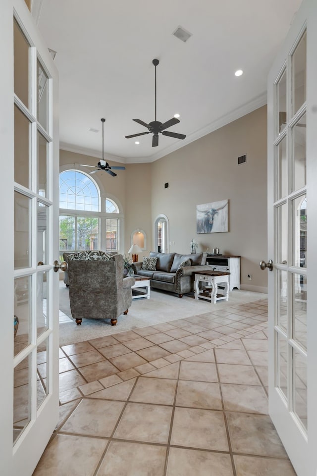 living area featuring french doors, recessed lighting, ornamental molding, and ceiling fan