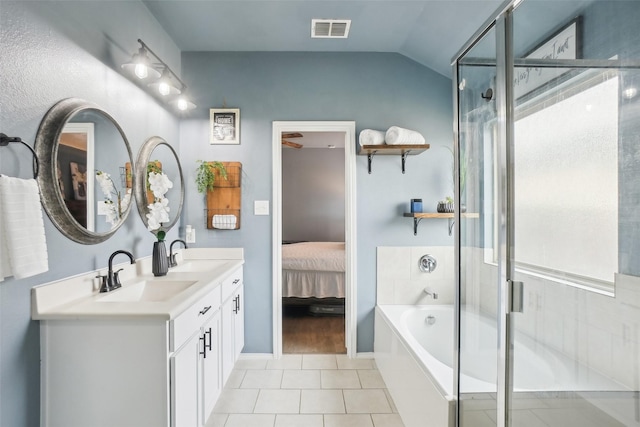 ensuite bathroom with a stall shower, a sink, and visible vents