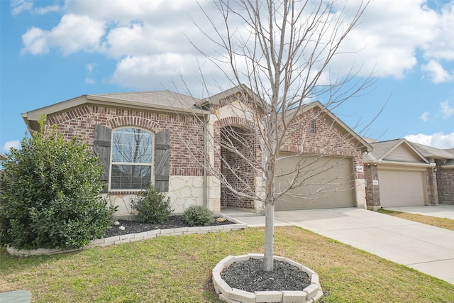 view of front of house with brick siding, concrete driveway, a garage, stone siding, and a front lawn