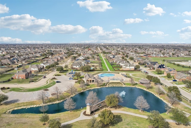 bird's eye view with a water view and a residential view