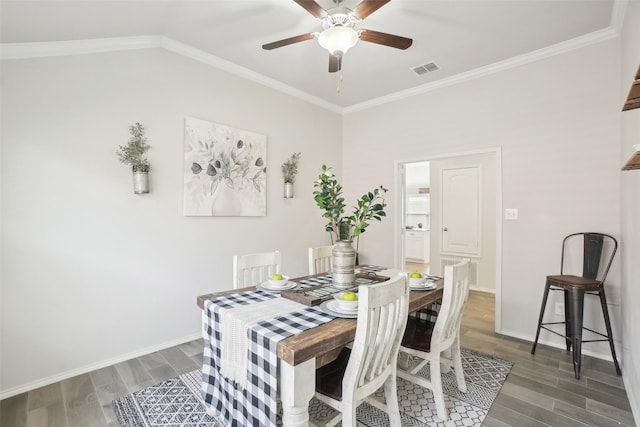 dining area with ornamental molding, visible vents, baseboards, and wood finished floors