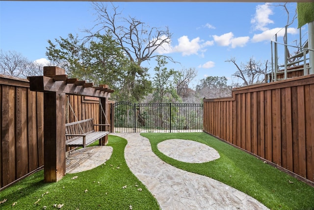 view of yard featuring a gate and fence