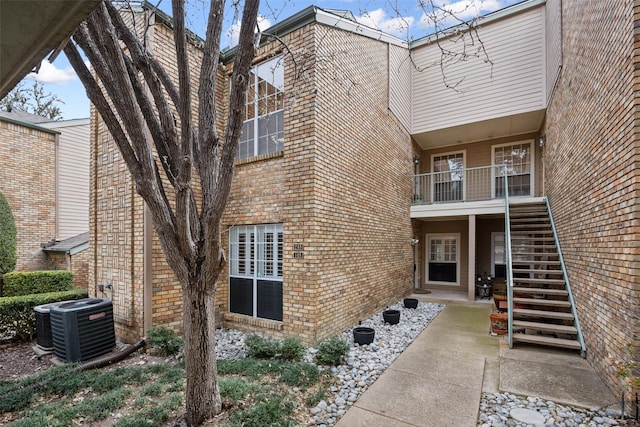 exterior space featuring stairway and central AC