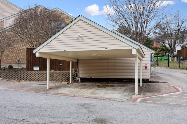 view of vehicle parking featuring a carport