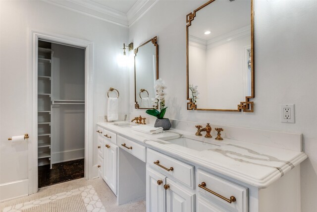 full bath with ornamental molding, a sink, and double vanity