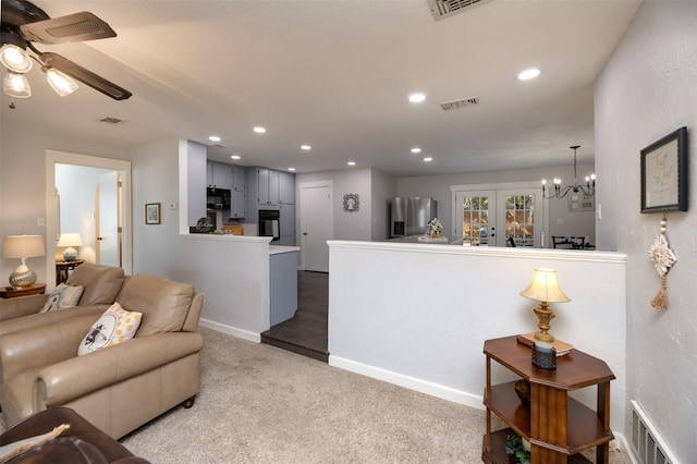 living room with carpet, visible vents, and recessed lighting