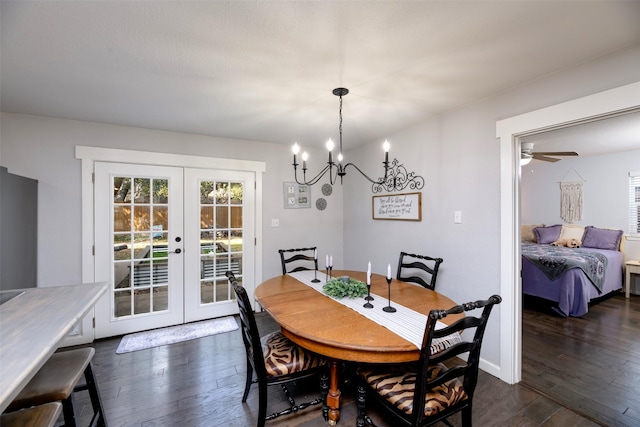 dining area featuring dark wood-style floors, baseboards, and french doors