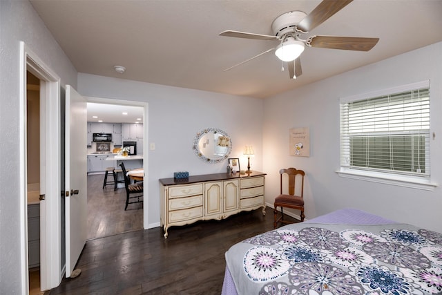 bedroom featuring dark wood-style floors and ceiling fan