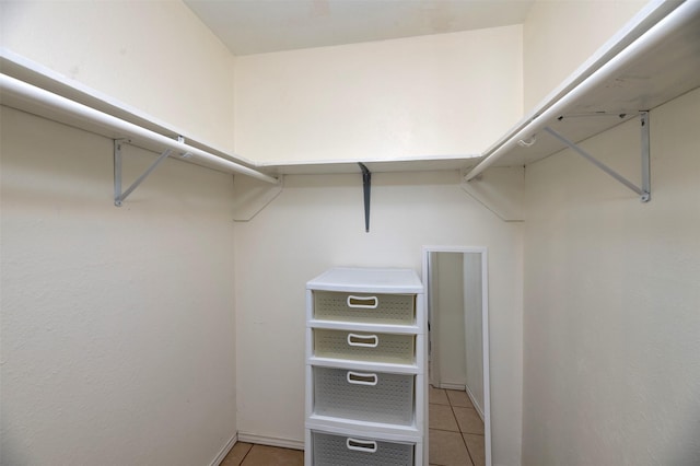 spacious closet featuring light tile patterned floors