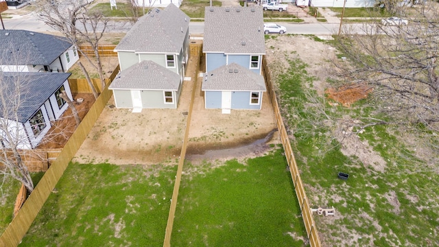 birds eye view of property with a residential view