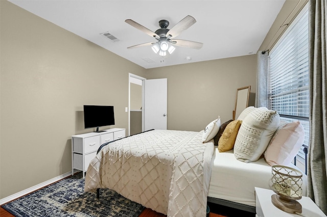 bedroom featuring visible vents, ceiling fan, and baseboards