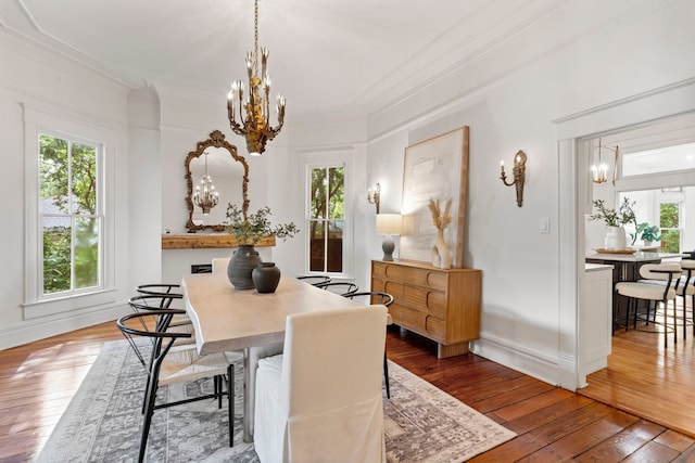 1502 W Virginia St, Mckinney, TX 75069 - dining space featuring a chandelier, hardwood / wood-style floors, and crown molding
