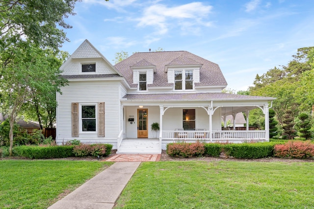 1502 W Virginia St, Mckinney, TX 75069 - victorian home with a porch, a shingled roof, and a front yard