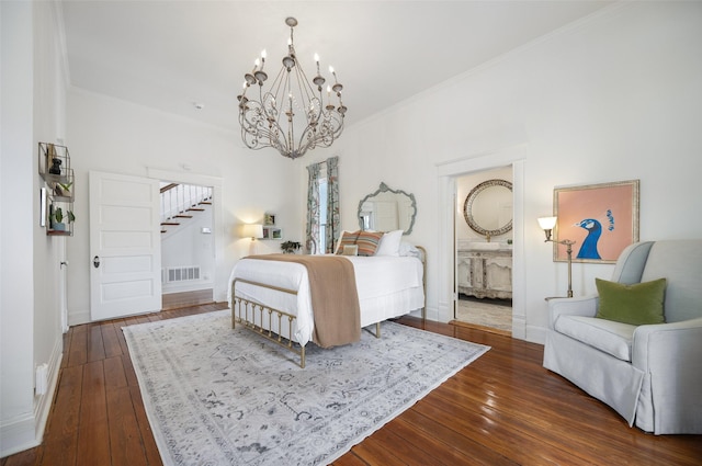1502 W Virginia St, Mckinney, TX 75069 - bedroom with a chandelier, dark wood-style flooring, ornamental molding, and baseboards