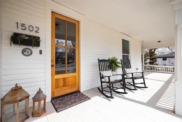 view of exterior entry featuring a porch