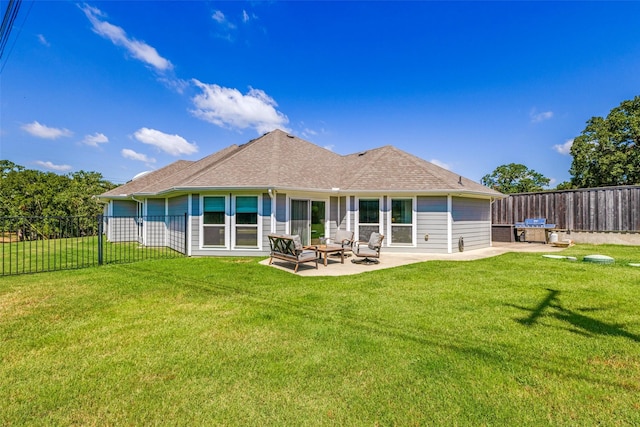 rear view of property featuring a patio area, a lawn, and fence