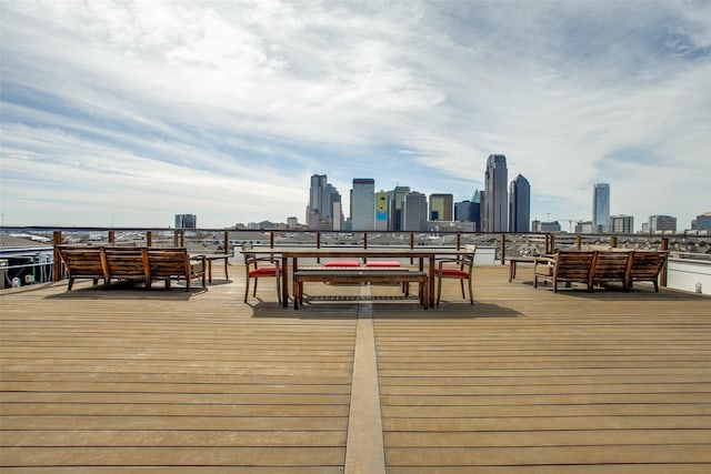 wooden terrace featuring a view of city