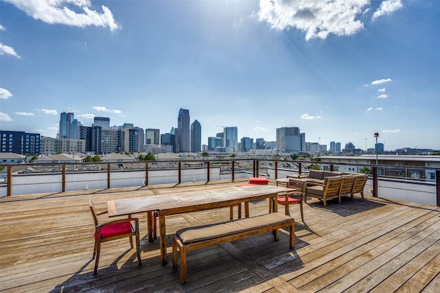 wooden terrace featuring a view of city