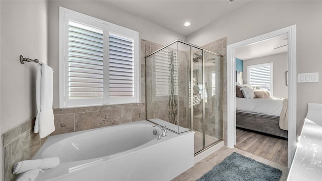 ensuite bathroom featuring a stall shower, recessed lighting, a bath, and ensuite bathroom