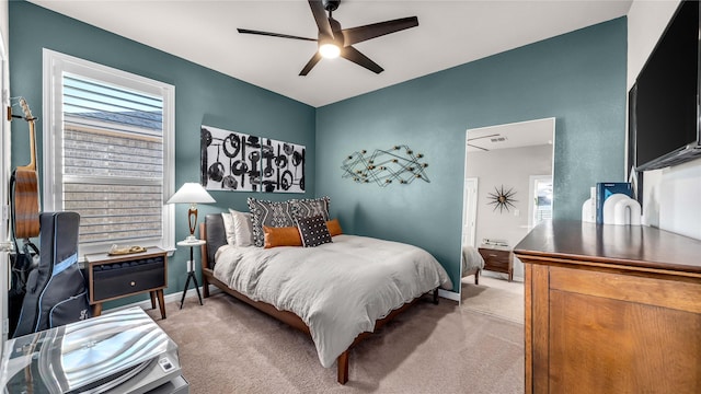 bedroom featuring a ceiling fan, carpet, and baseboards