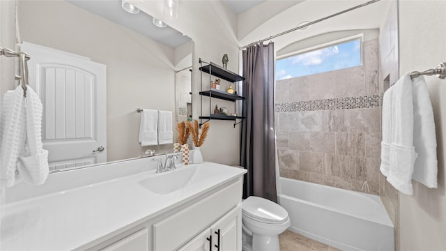 bathroom with vanity, toilet, and shower / bathtub combination with curtain