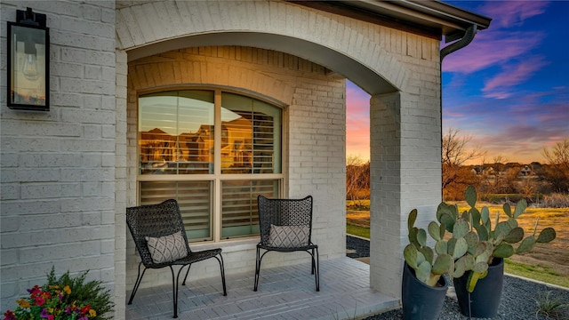 view of patio terrace at dusk