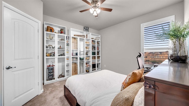 carpeted bedroom with ceiling fan