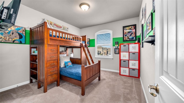 bedroom featuring carpet flooring and baseboards