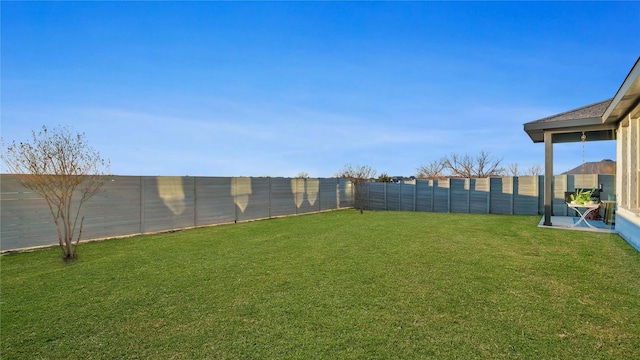 view of yard featuring a fenced backyard