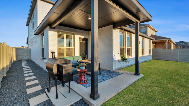 view of patio with a fenced backyard and a gate