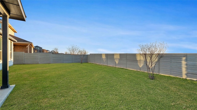 view of yard with a fenced backyard