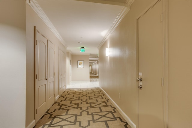 corridor with baseboards and ornamental molding