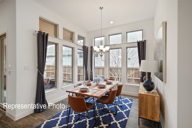 dining area with a notable chandelier, baseboards, wood finished floors, and recessed lighting