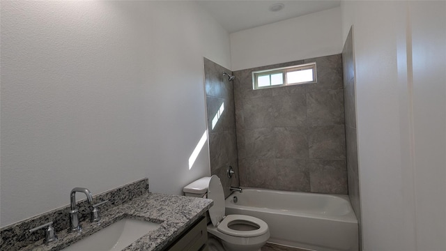 full bathroom featuring washtub / shower combination, vanity, and toilet