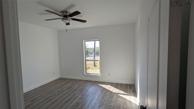 unfurnished room with ceiling fan, baseboards, and wood finished floors